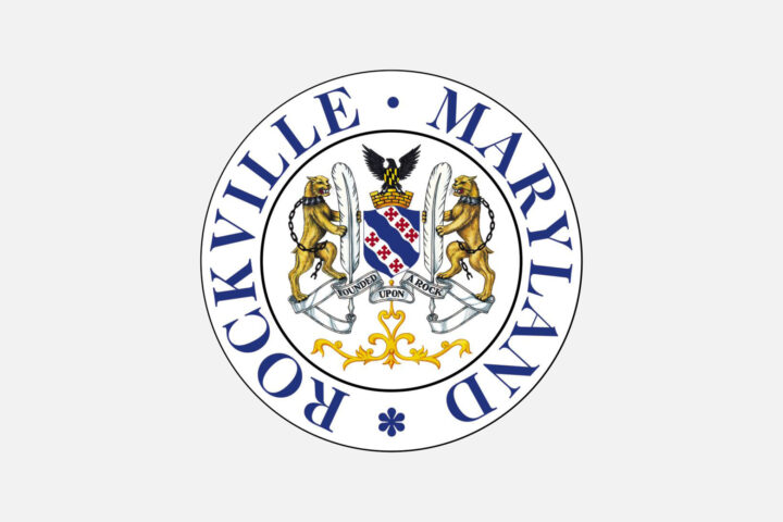 The official seal of Rockville, Maryland, featuring two lions, a shield with symbols, and an eagle, encircled by the text “Rockville Maryland.”.