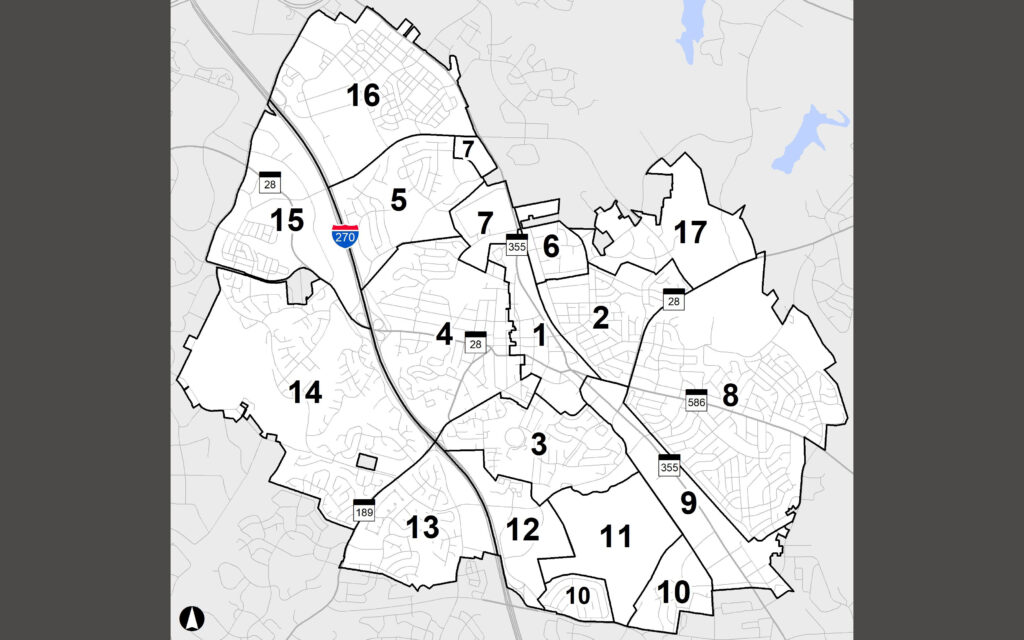 Black and white map showing a city divided into 17 numbered districts with highway I-270 running through district 15. Major roads and some bodies of water are also visible.