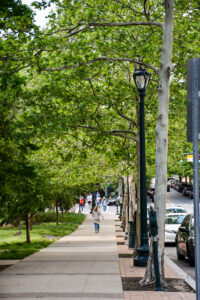 People walking down a sidewalk