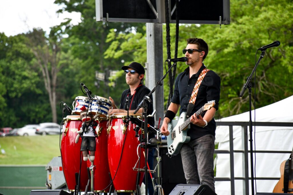 A band playing on stage at Hometown Holidays