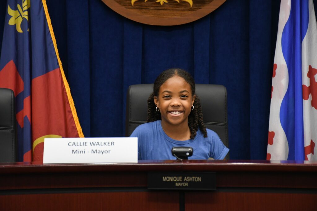 Callie Walker sitting in the mayor's seat