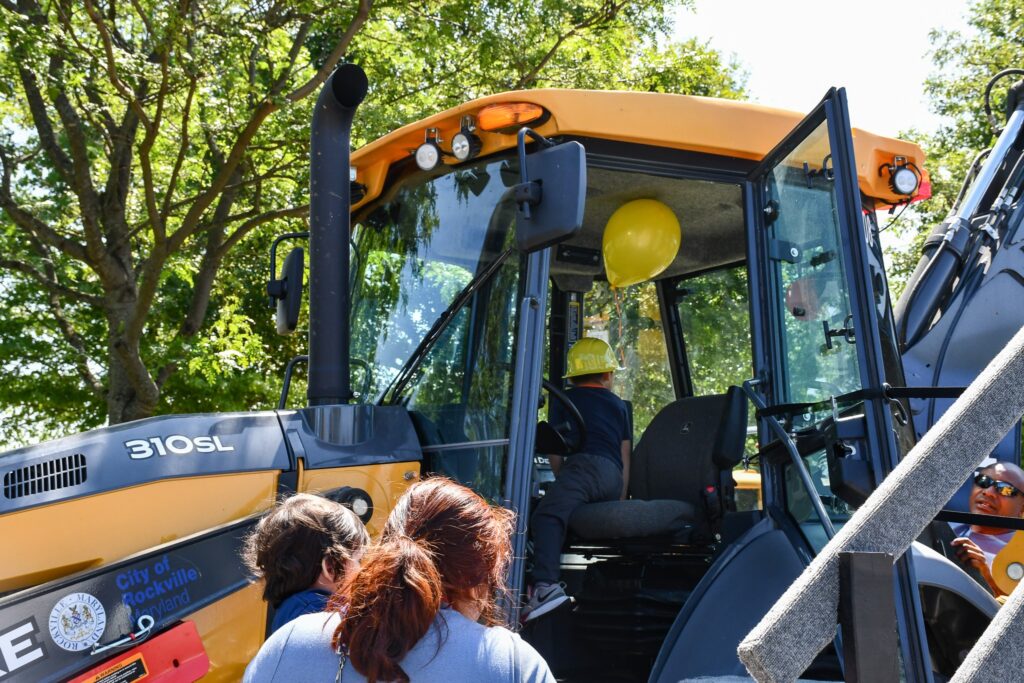 Child exploring the inside of a bulldozer
