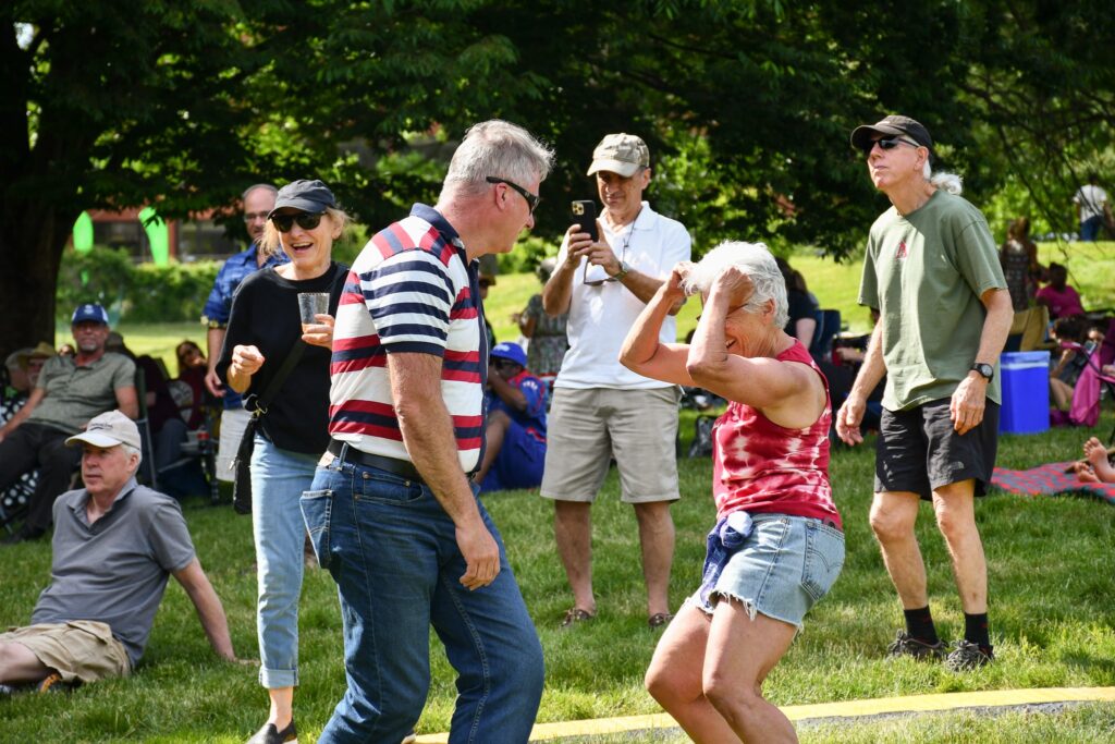 Two people dancing in a crowd