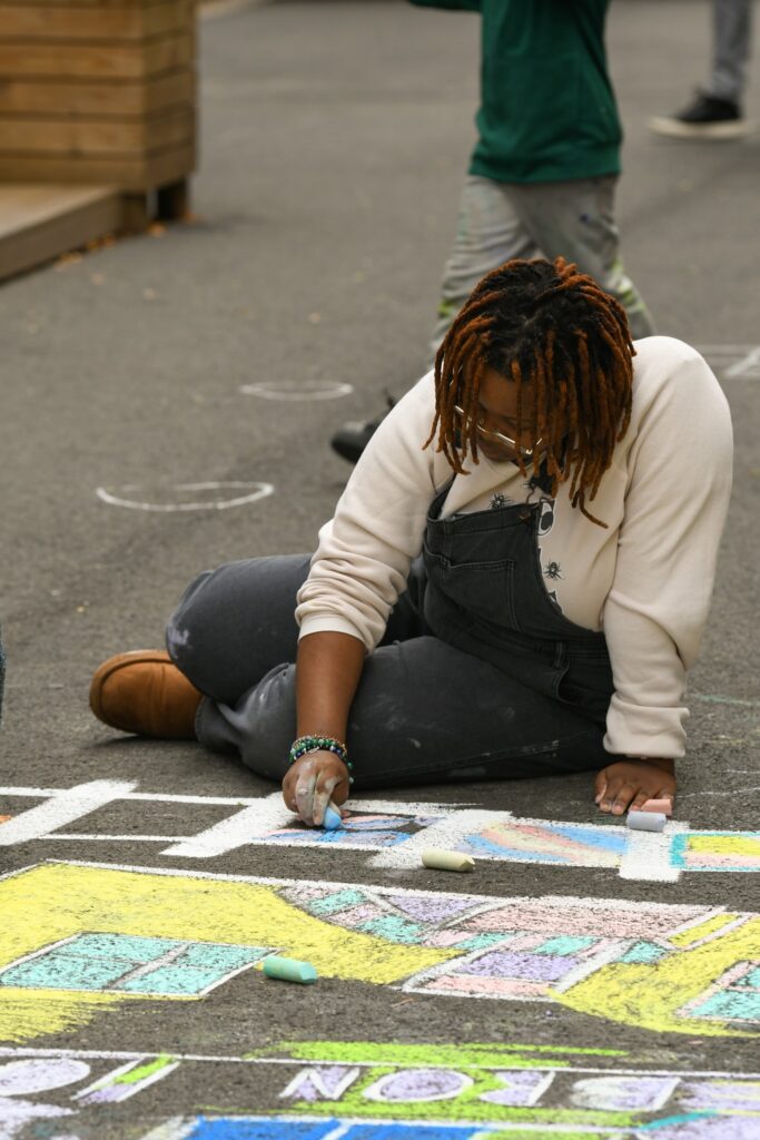 Public creating chalk art in Town Center