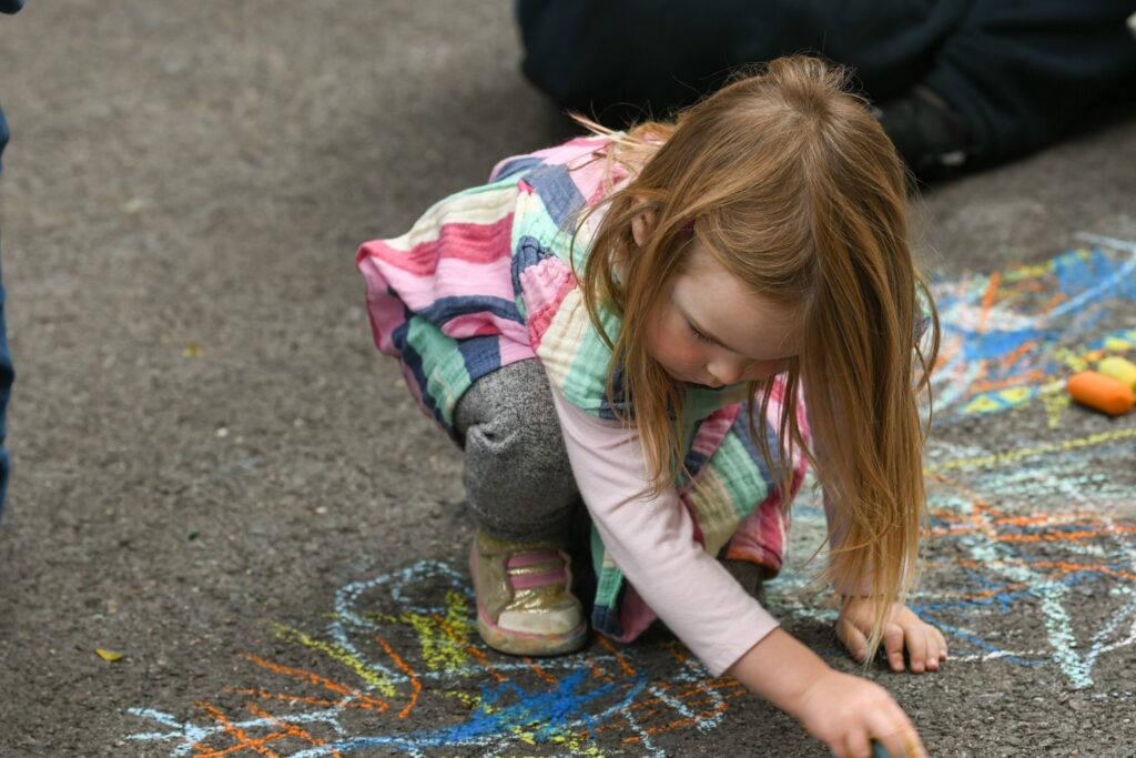 Public creating chalk art in Town Center