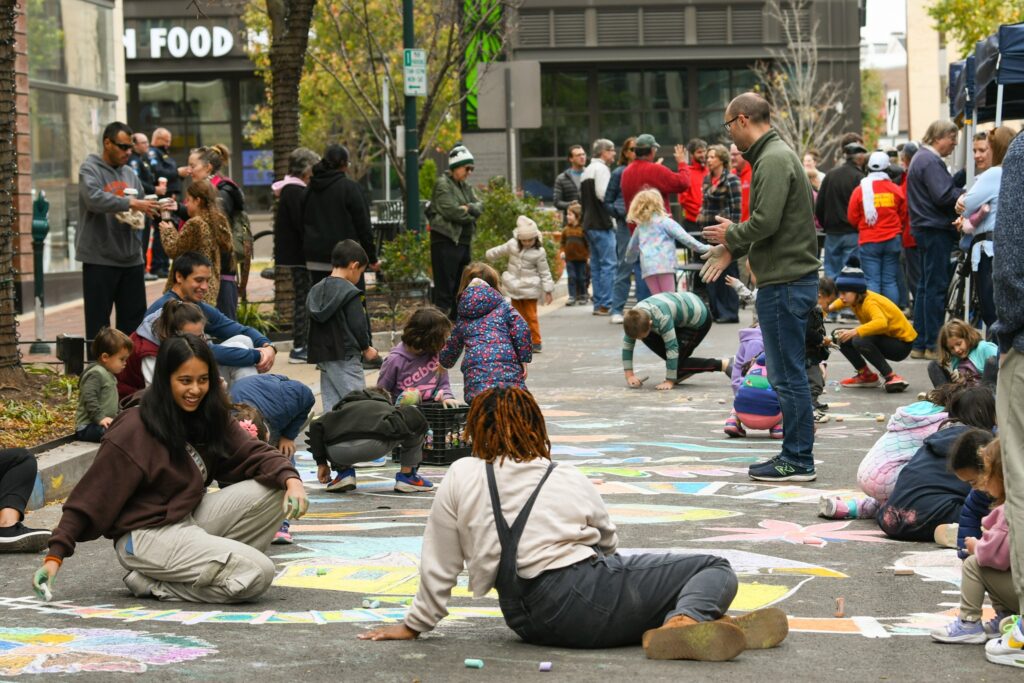 Public creating chalk art in Town Center