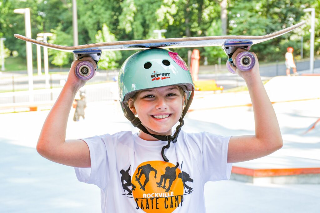 Child holding a skateboard