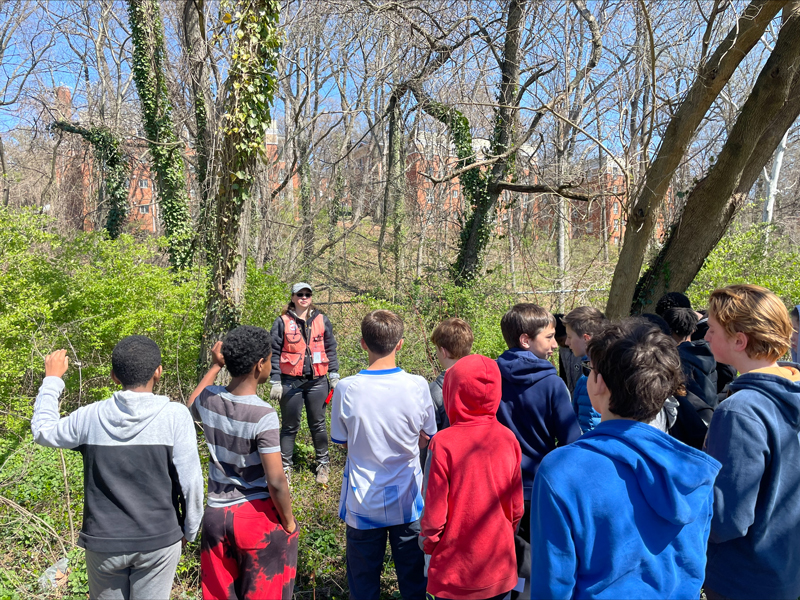 Natasha Shangold with students in a forest