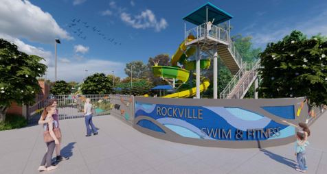 People walk near the entrance of Rockville Swim & Fitness Center, which features a tall waterslide and a blue sign.