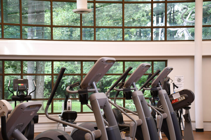 A group of exercise machines in a gym.