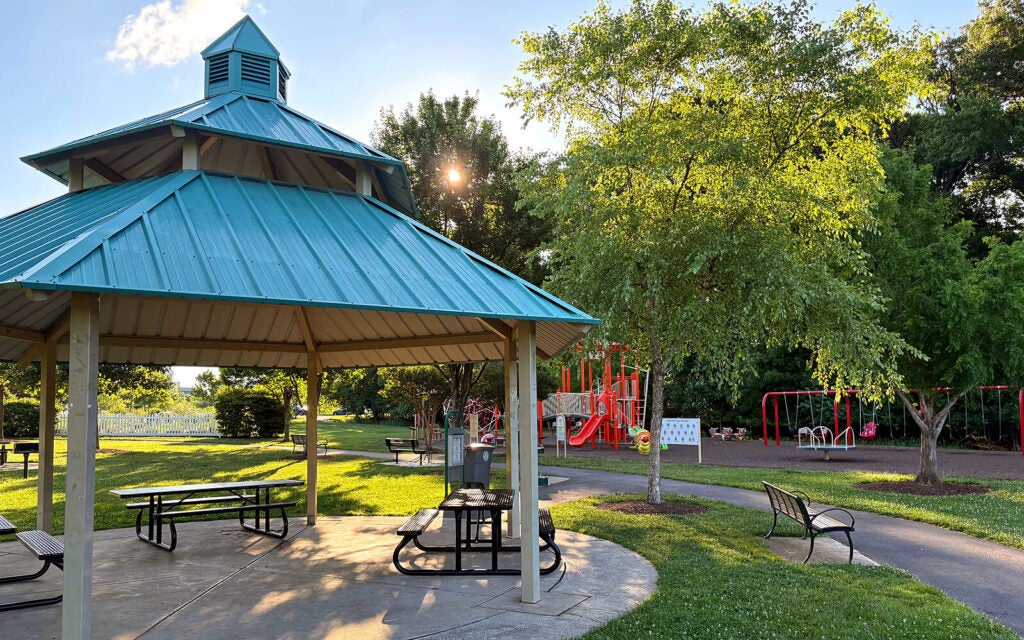 Fallsgrove Park features a pavilion equipped with tables and grills, available for rent, as well as a playground for community use.