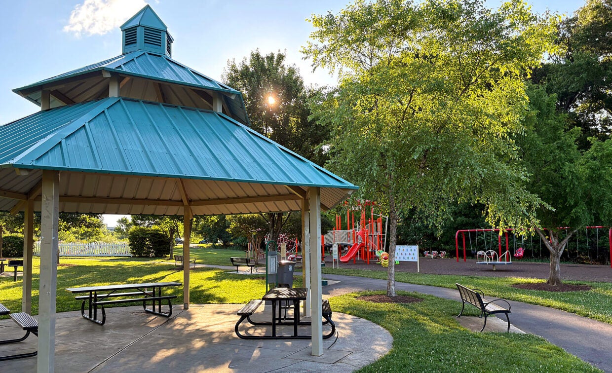 Fallsgrove Park features a pavilion equipped with tables and grills, available for rent, as well as a playground for community use.