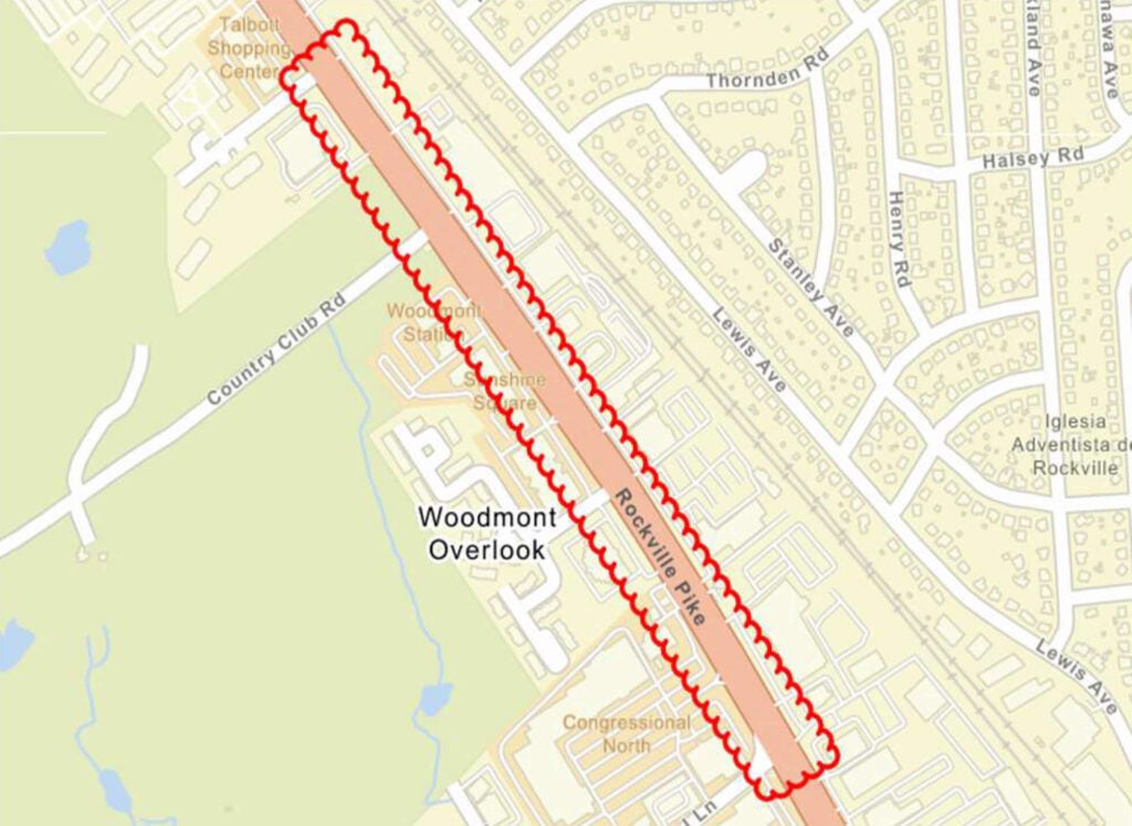 A map shows a highlighted section of Rockville Pike running northeast-southwest near Woodmont Overlook, bordered by residential neighborhoods and shopping centers.